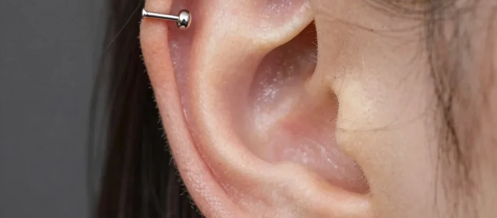 Conch Piercing Guide: Choosing Between Studs and Hoops